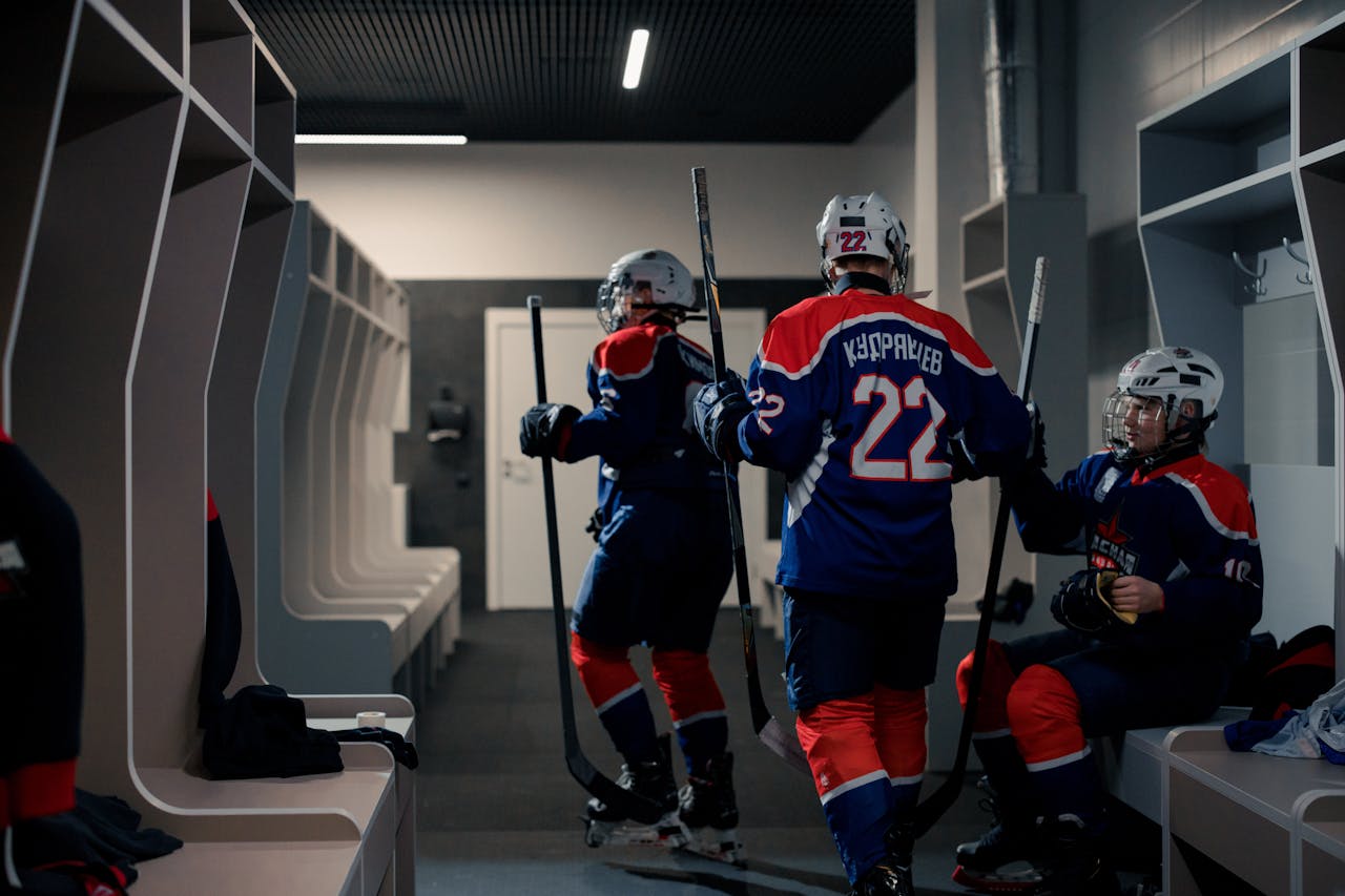 Mastering the First Impression: Your intriguing post title goes here A team of hockey players getting ready in the locker room before the game.
